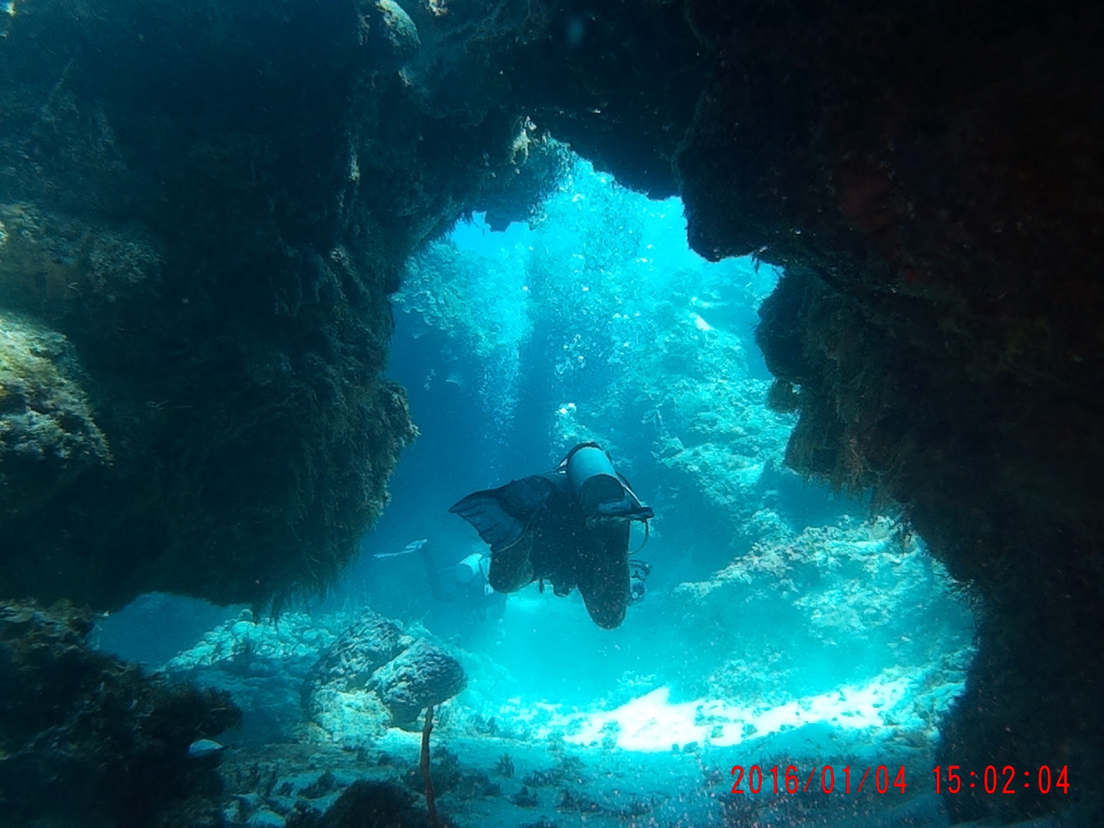 A diver swimming through open water
